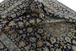 Surface texture of 2000s Kashan rug with natural Wool and intricate pattern