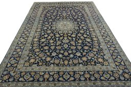 Surface texture of 2000s Kashan rug with natural Wool and intricate pattern