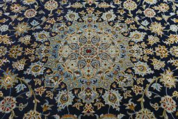 Central medallion detail of 2000s Kashan rug from Iran / Persia