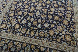Close-up detail of 2000s Kashan rug from Iran / Persia showing Wool weave