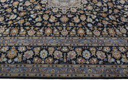 Corner detail of 2000s Kashan rug showing border pattern and Wool pile