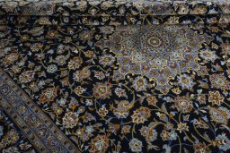 Close-up detail of 2000s Kashan rug from Iran / Persia showing Wool weave