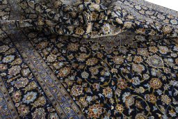 Surface texture of 2000s Kashan rug with natural Wool and intricate pattern