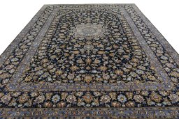 Surface texture of 2000s Kashan rug with natural Wool and intricate pattern