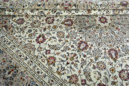 Close-up detail of 2000s Kashan rug from Iran / Persia showing Wool weave