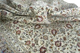 Surface texture of 2000s Kashan rug with natural Wool and intricate pattern