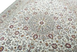 Backside of handmade 2000s Kashan rug showing knot structure and weave density