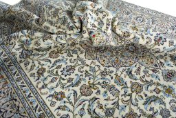 Surface texture of 2000s Kashan rug with natural Wool and intricate pattern
