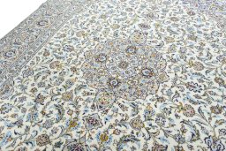 Backside of handmade 2000s Kashan rug showing knot structure and weave density