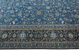 Corner detail of 2000s Kashan rug showing border pattern and Wool pile