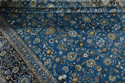 Close-up detail of 2000s Kashan rug from Iran / Persia showing Wool weave
