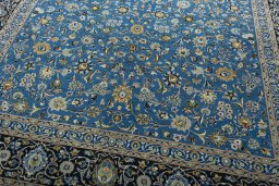 Close-up detail of 2000s Kashan rug from Iran / Persia showing Wool weave