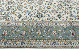Corner detail of 2000s Kashan rug showing border pattern and Wool pile