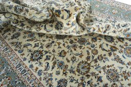 Surface texture of 2000s Kashan rug with natural Wool and intricate pattern