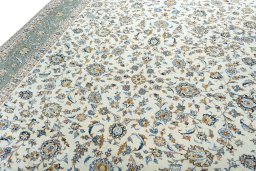 Backside of handmade 2000s Kashan rug showing knot structure and weave density