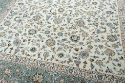 Close-up detail of 2000s Kashan rug from Iran / Persia showing Wool weave