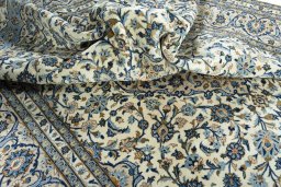 Surface texture of 2000s Kashan rug with natural Wool and intricate pattern