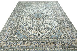 Surface texture of 2000s Kashan rug with natural Wool and intricate pattern