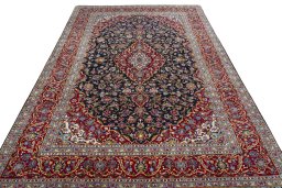 Backside of handmade 2000s Kashan rug showing knot structure and weave density