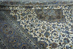 Close-up detail of 2000s Kashan rug from Iran / Persia showing Cork weave