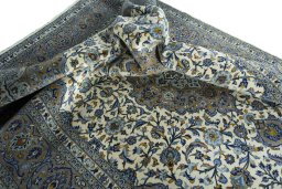 Surface texture of 2000s Kashan rug with natural Cork and intricate pattern