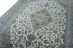 Backside of handmade 2000s Kashan rug showing knot structure and weave density