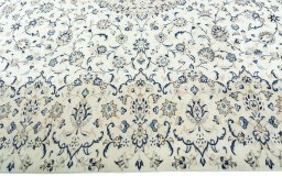 Corner detail of 2000s Kashan rug showing border pattern and Wool pile