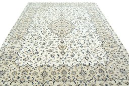 Surface texture of 2000s Kashan rug with natural Wool and intricate pattern