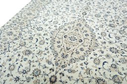 Backside of handmade 2000s Kashan rug showing knot structure and weave density