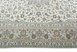 Corner detail of 2000s Kashan rug showing border pattern and Wool pile