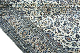 Close-up detail of 2000s Kashan rug from Iran / Persia showing Wool weave