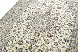 Backside of handmade 2000s Kashan rug showing knot structure and weave density