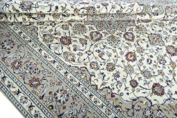 Close-up detail of 2000s Kashan rug from Iran / Persia showing Wool weave