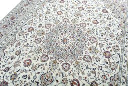 Backside of handmade 2000s Kashan rug showing knot structure and weave density