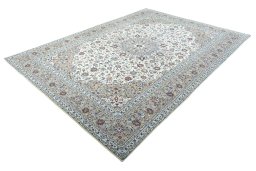 Corner detail of 2000s Kashan rug showing border pattern and Wool pile
