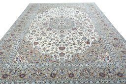 Surface texture of 2000s Kashan rug with natural Wool and intricate pattern