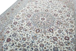 Backside of handmade 2000s Kashan rug showing knot structure and weave density
