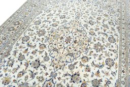 Backside of handmade 2000s Kashan rug showing knot structure and weave density