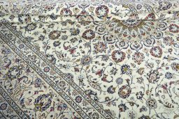Close-up detail of 2000s Kashan rug from Iran / Persia showing Wool weave