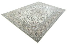 Corner detail of 2000s Kashan rug showing border pattern and Wool pile