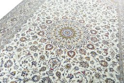 Backside of handmade 2000s Kashan rug showing knot structure and weave density