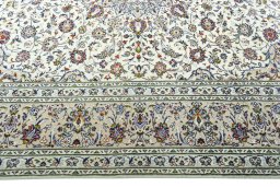 Corner detail of 2000s Kashan rug showing border pattern and Wool pile