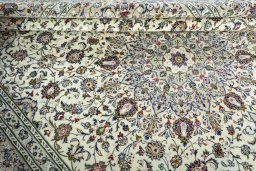 Close-up detail of 2000s Kashan rug from Iran / Persia showing Wool weave