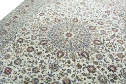 Backside of handmade 2000s Kashan rug showing knot structure and weave density