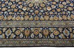 Corner detail of 2000s Kashan rug showing border pattern and Wool pile
