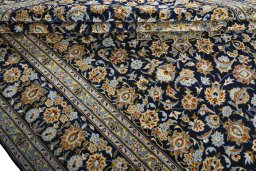 Close-up detail of 2000s Kashan rug from Iran / Persia showing Wool weave