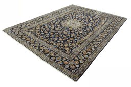 Corner detail of 2000s Kashan rug showing border pattern and Wool pile