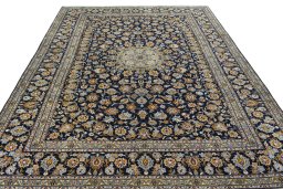 Surface texture of 2000s Kashan rug with natural Wool and intricate pattern