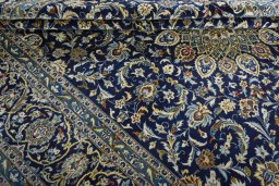 Close-up detail of 2000s Kashan rug from Iran / Persia showing Wool weave
