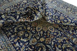 Surface texture of 2000s Kashan rug with natural Wool and intricate pattern